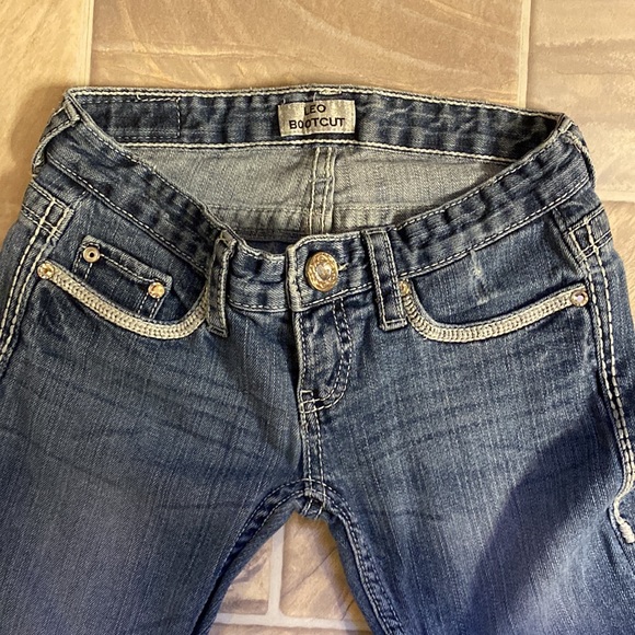 Low cut, boot cut jeans.  Small wear in pocket.  Shown in pictures - Picture 3 of 9